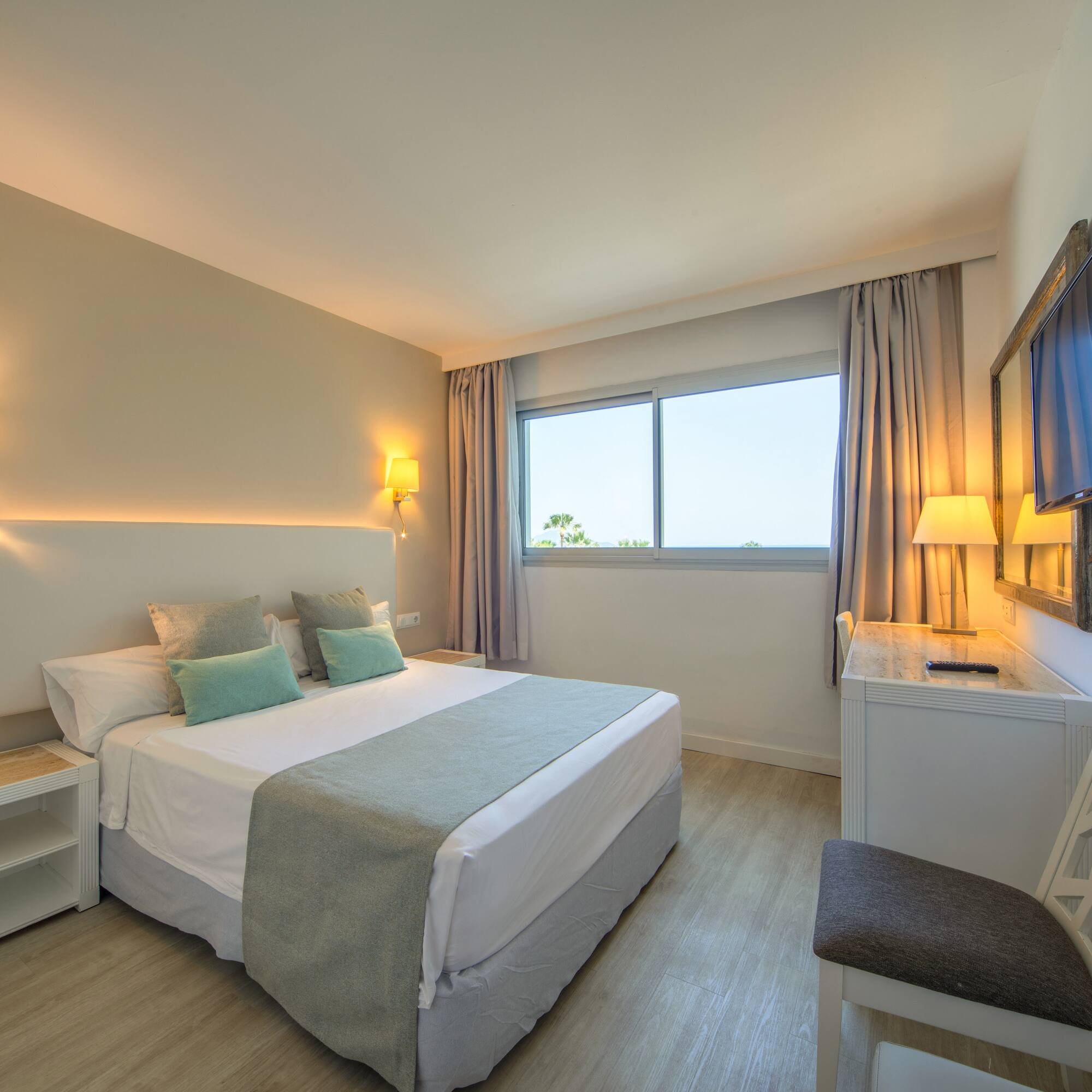 a bedroom with a bed and a table