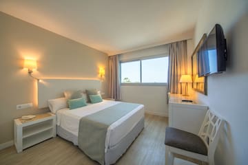 a bedroom with a bed and a table