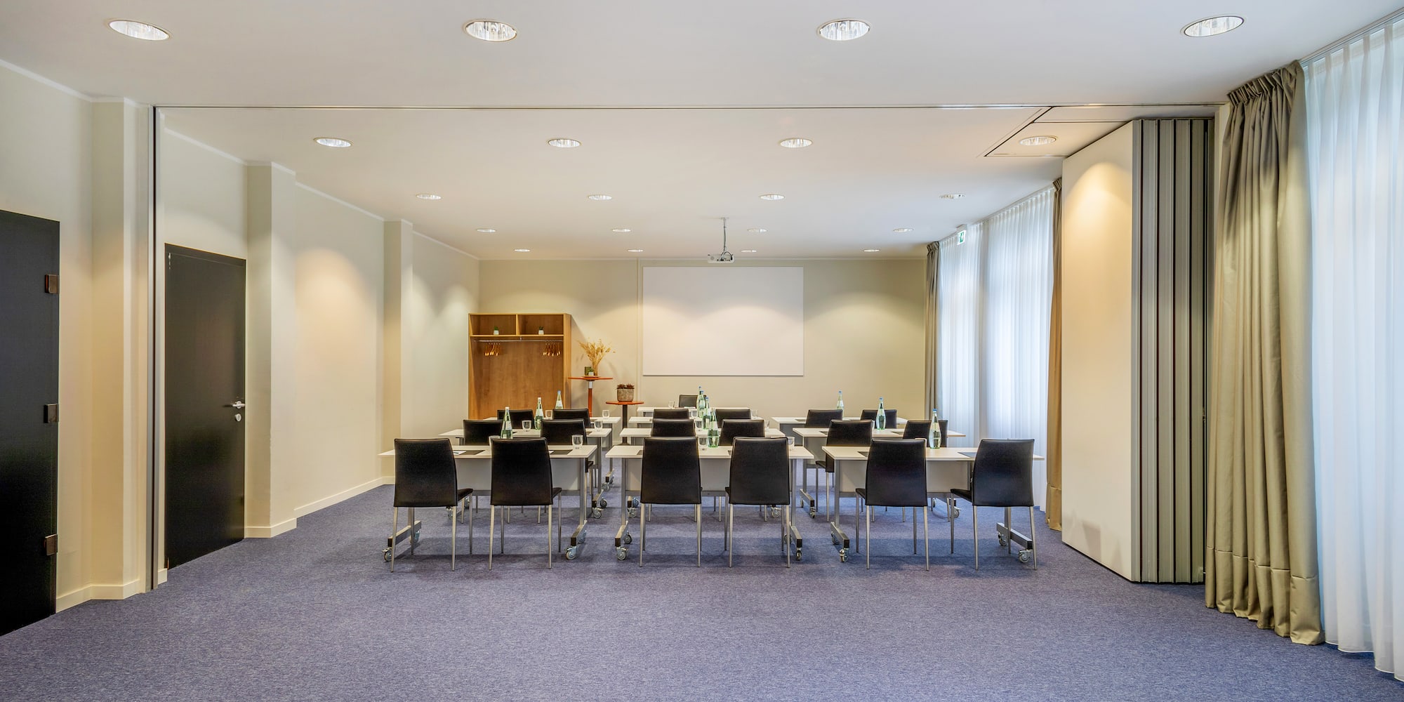a room with a large table and chairs