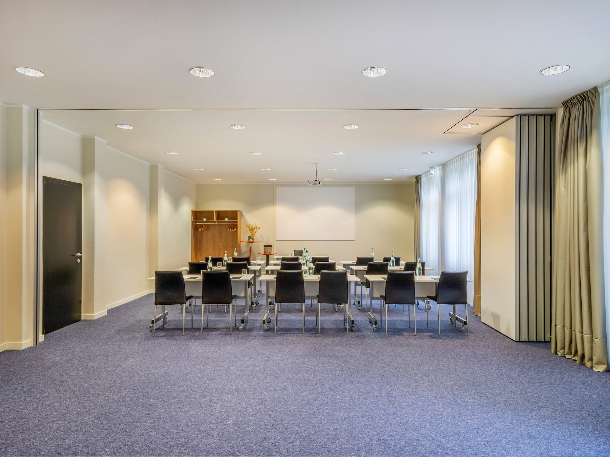 a room with a large table and chairs