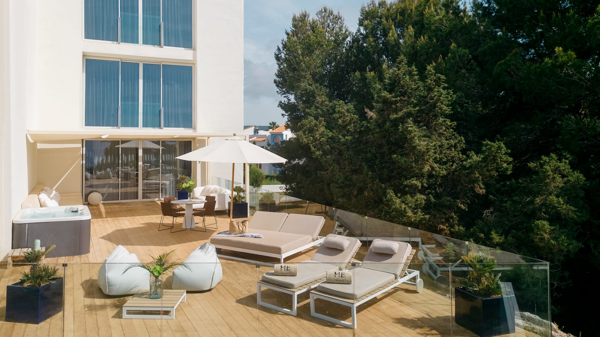 a deck with chairs and umbrellas on it