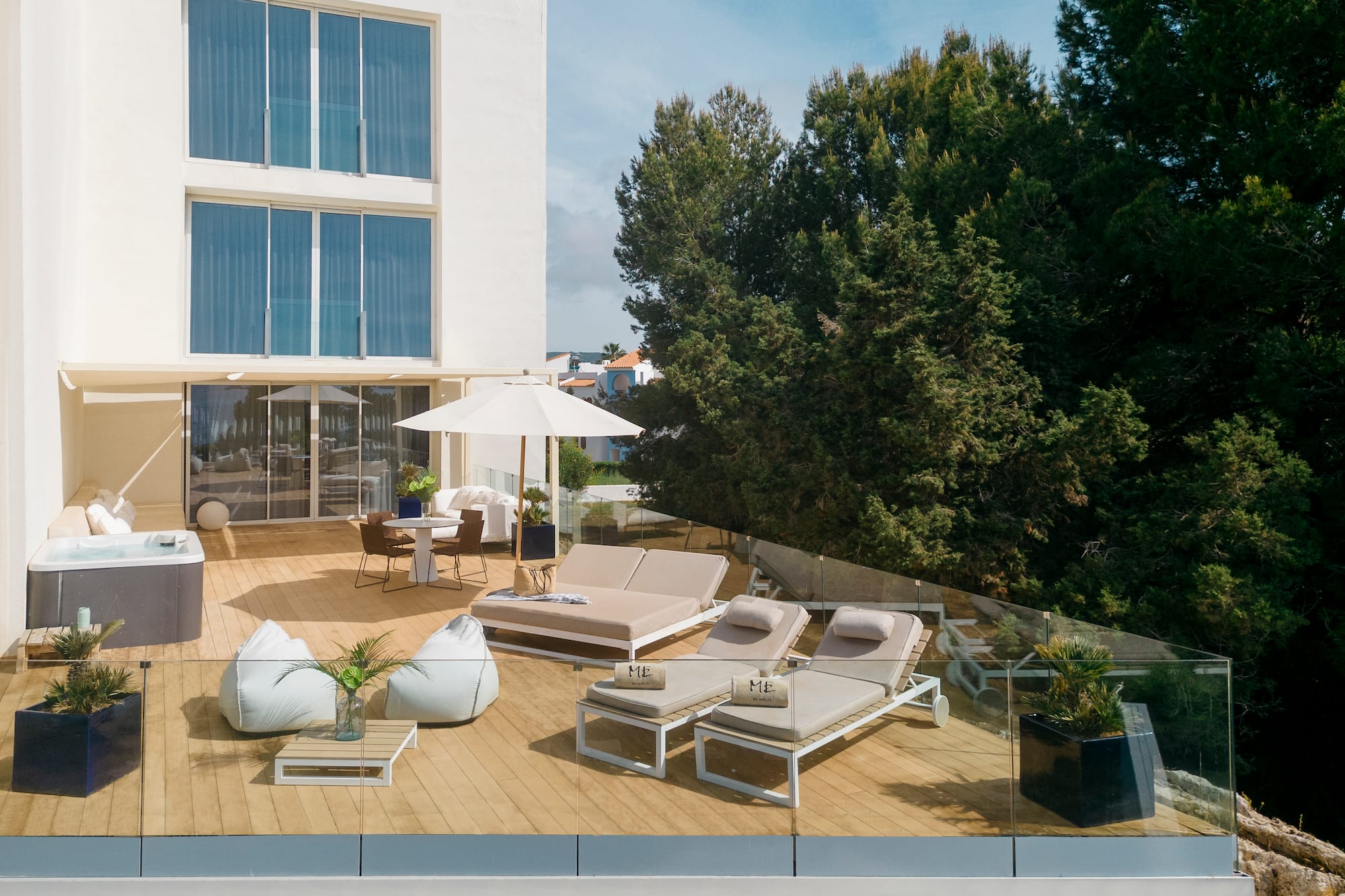 a deck with chairs and umbrellas on it
