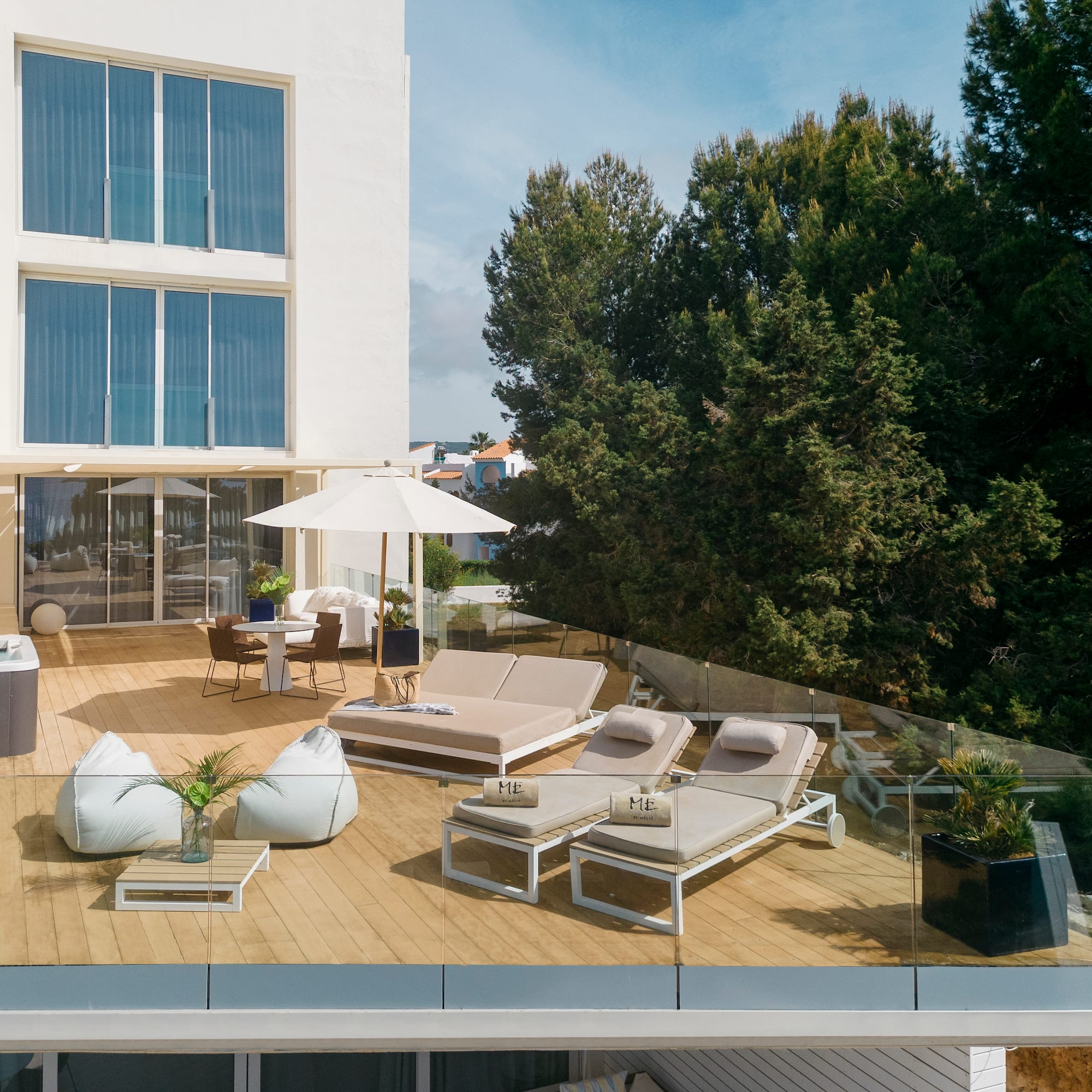 a deck with chairs and umbrellas on it