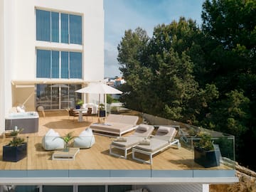 a deck with chairs and umbrellas on it