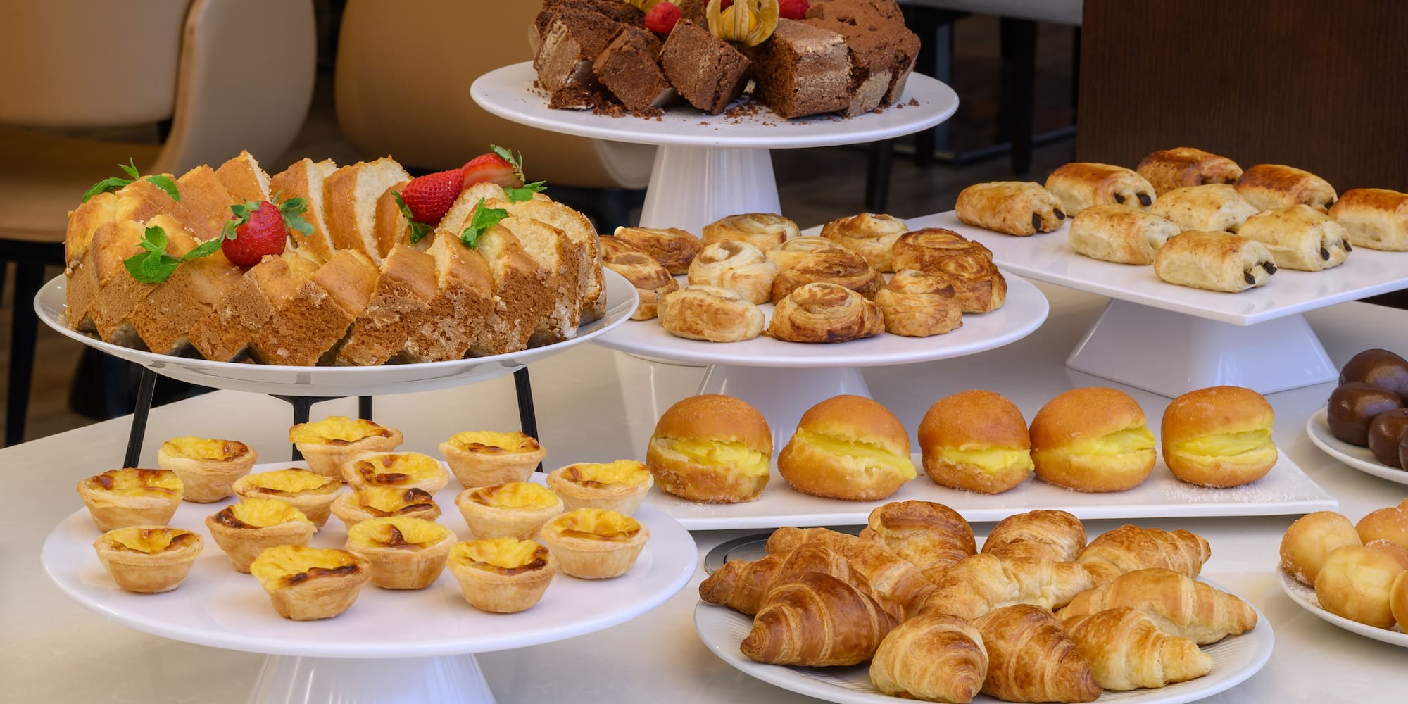 a group of plates of pastries