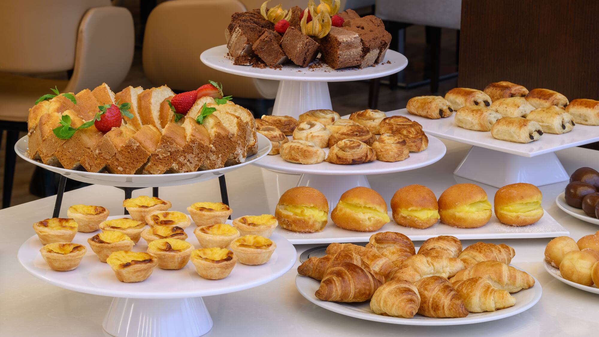 a group of plates of pastries