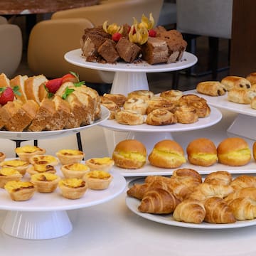 a group of plates of pastries