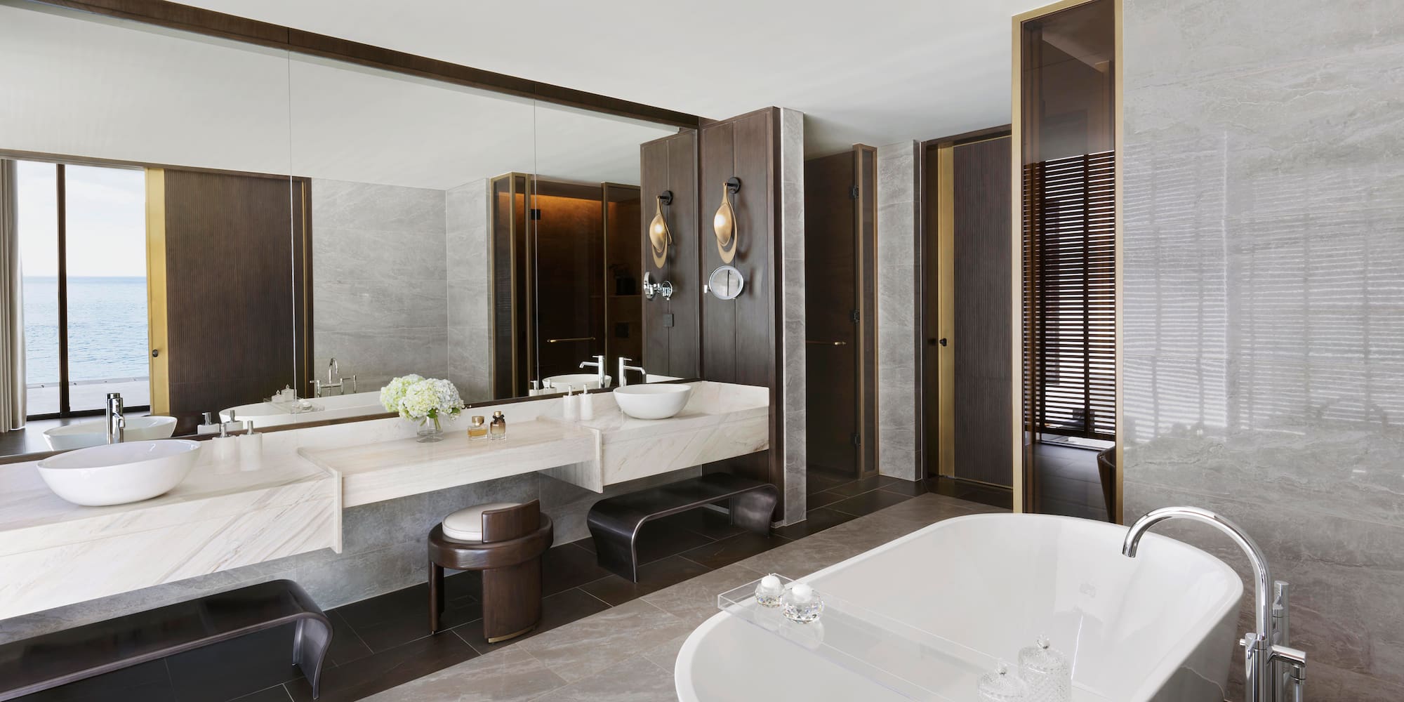 a bathroom with a large tub and sink