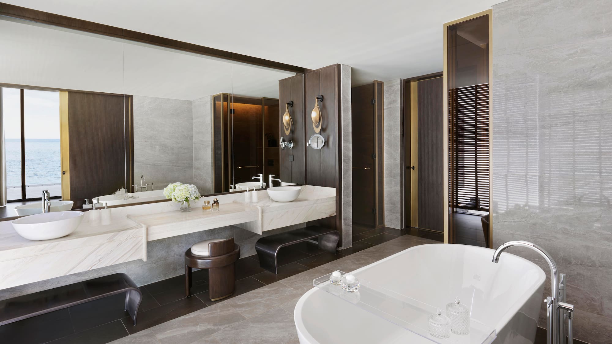 a bathroom with a large tub and sink