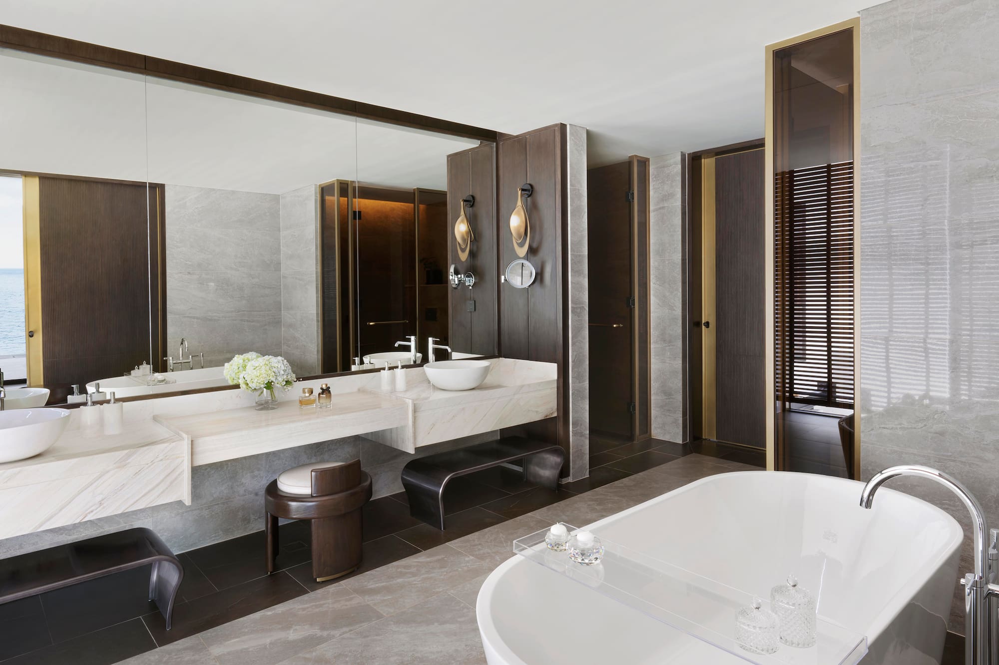 a bathroom with a large tub and sink