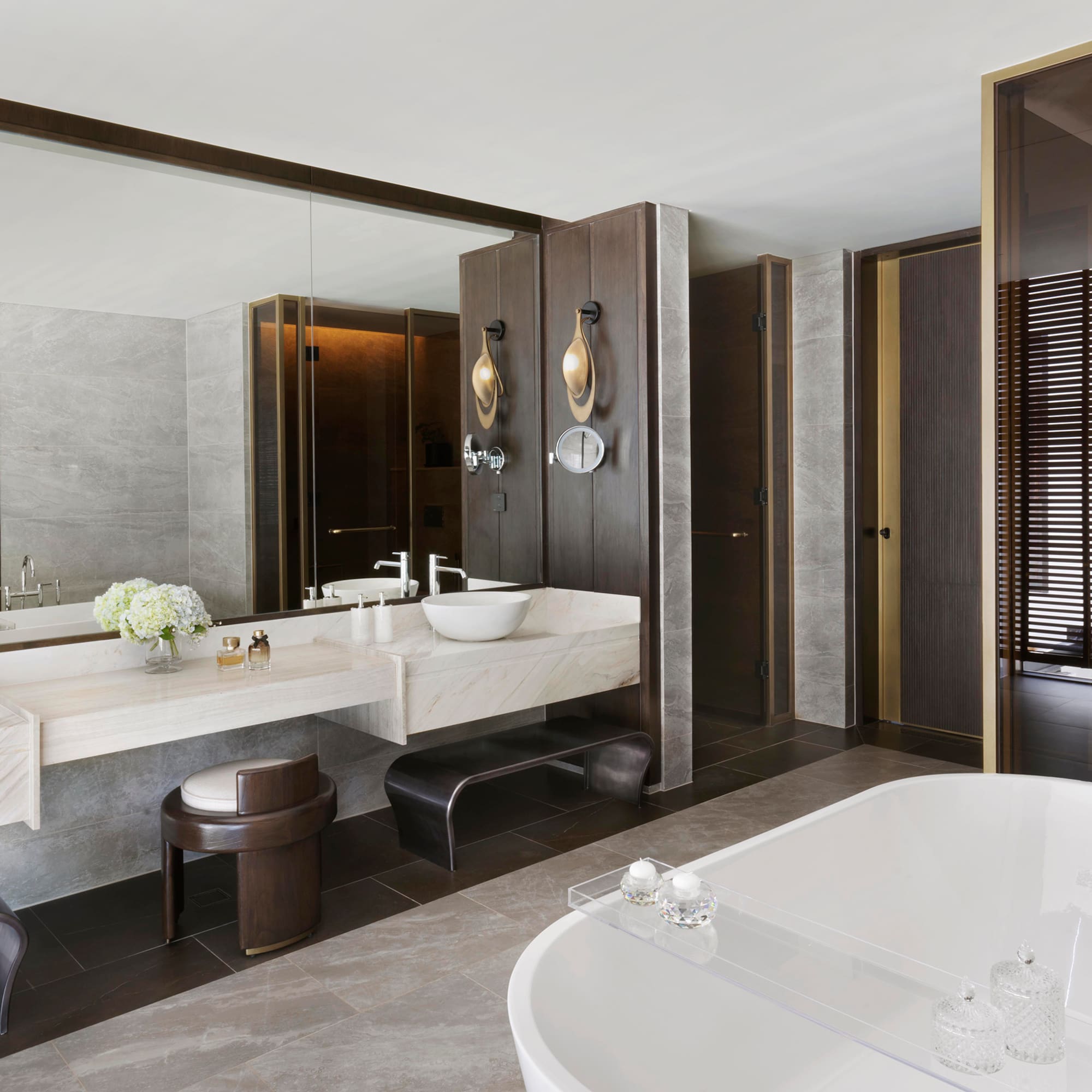 a bathroom with a large tub and sink