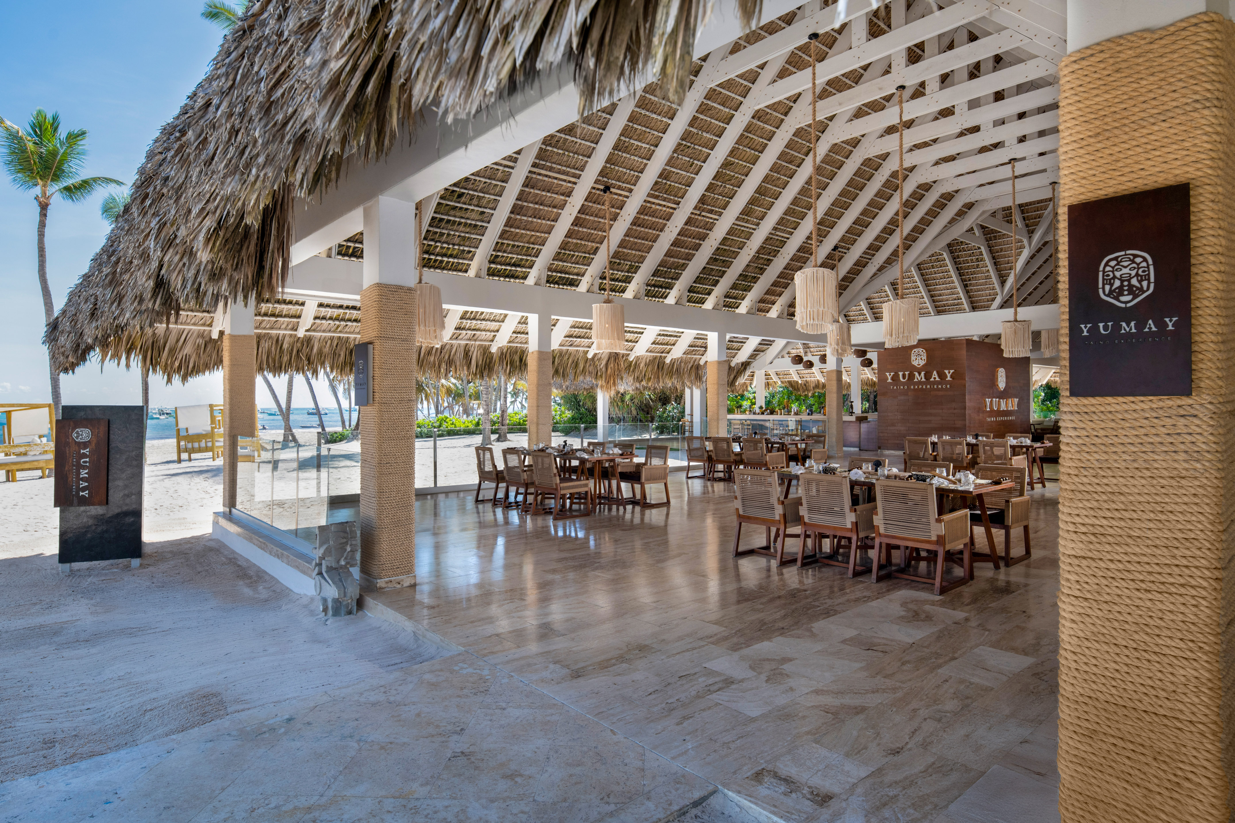Yumay beachfront palapa restaurant with open-air dining and ocean views.