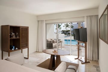 a living room with a television and a pool