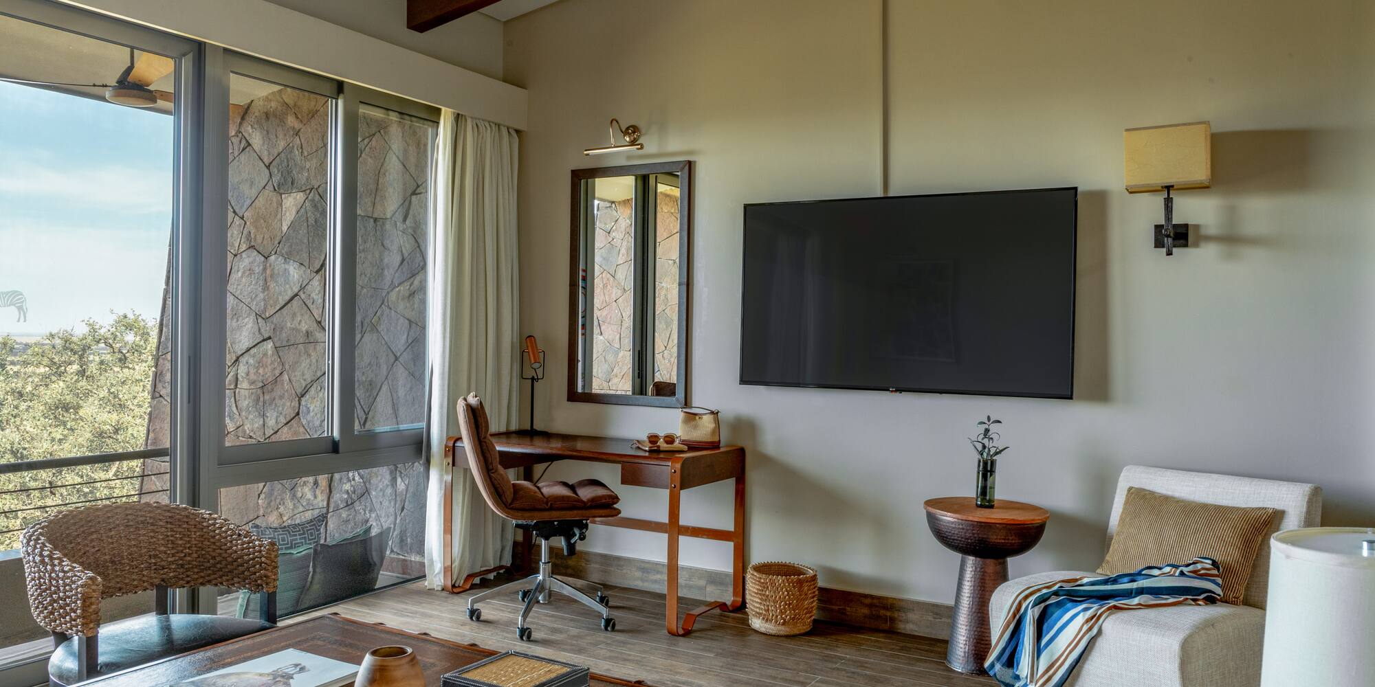 a living room with a television and a table