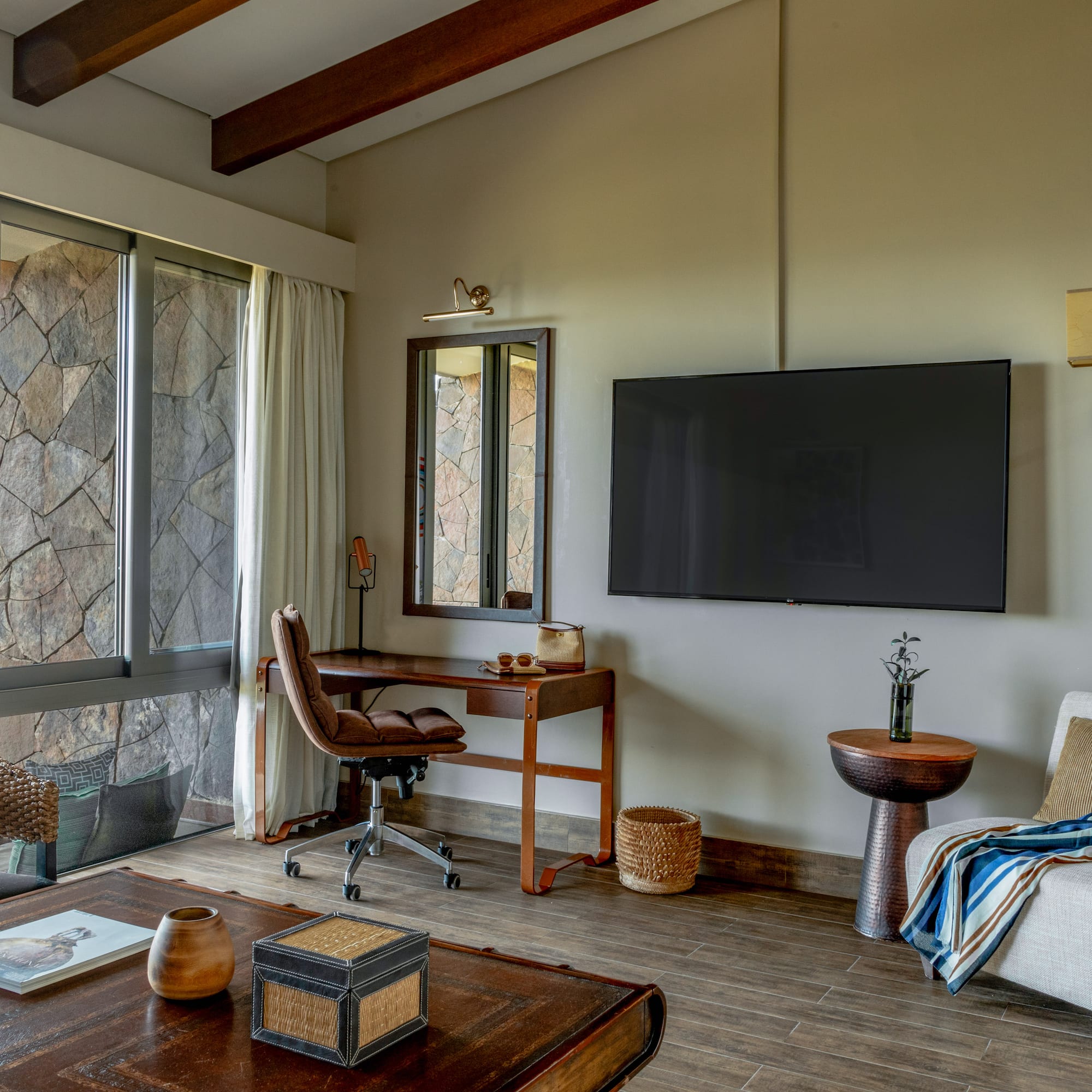 a living room with a television and a table