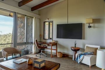 a living room with a television and a table