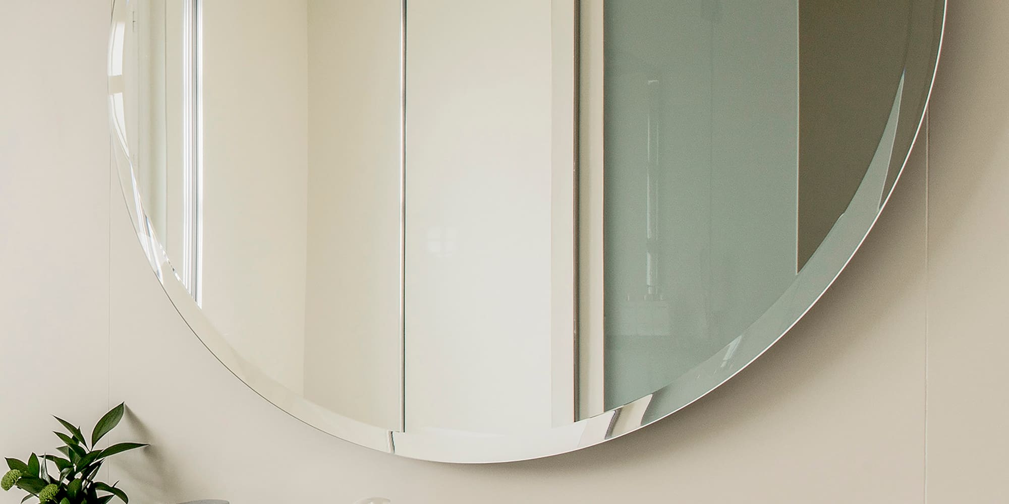 a mirror above a sink