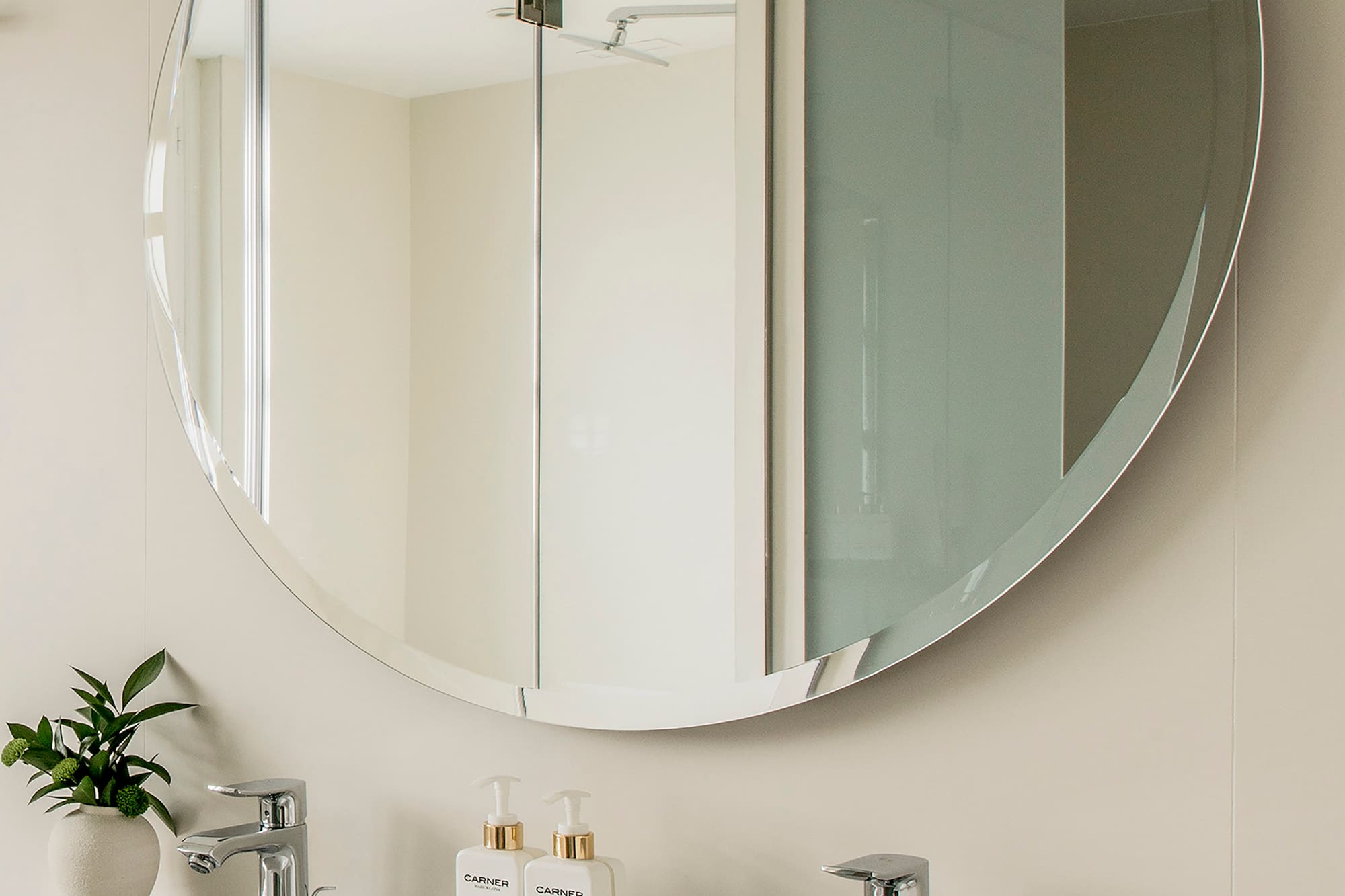 a mirror above a sink