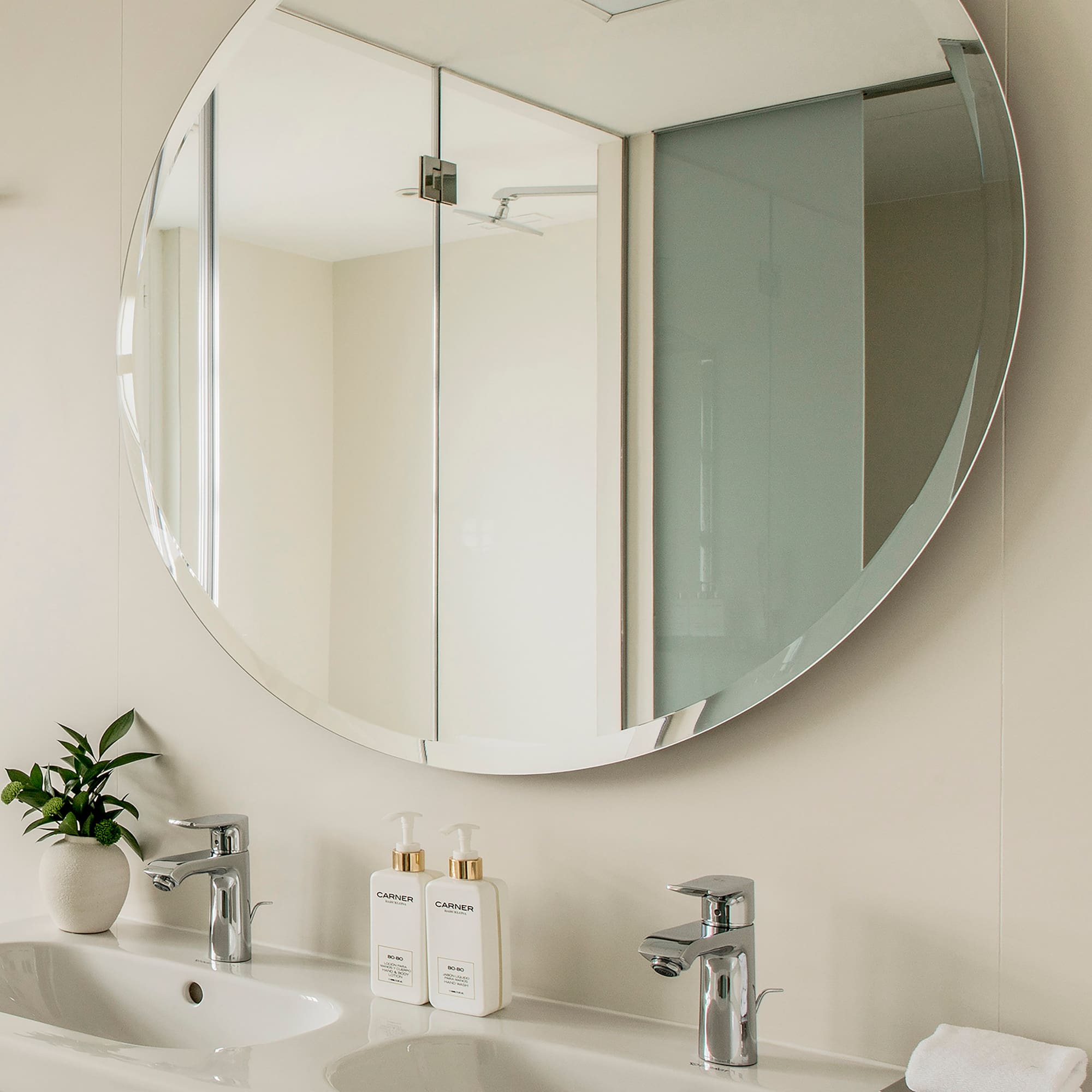 a mirror above a sink