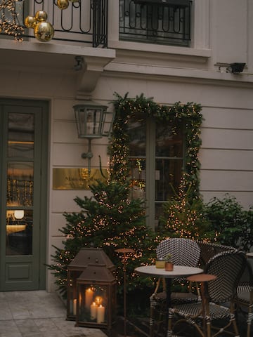 a building with a table and chairs and a lantern