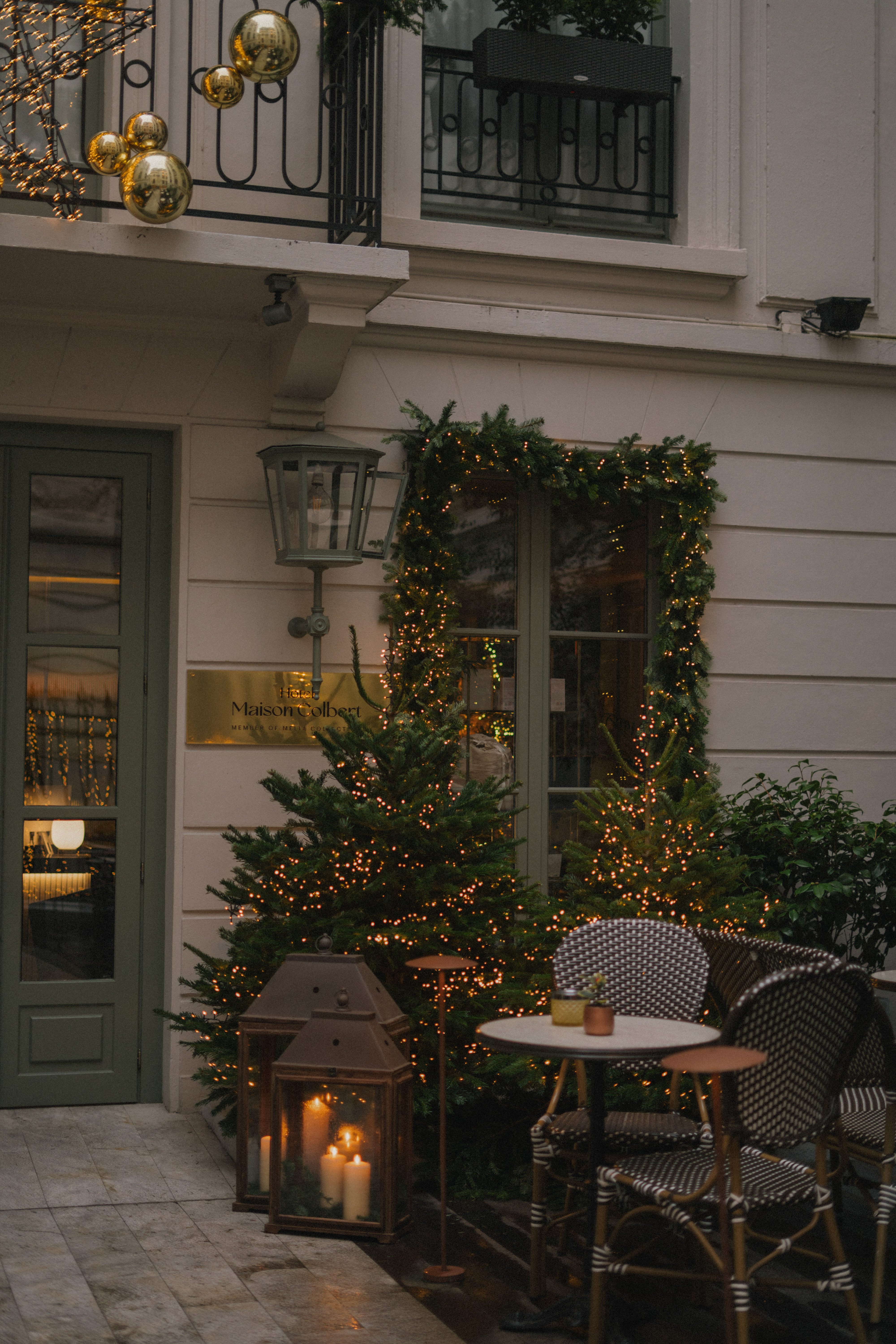 a building with a table and chairs and a lantern