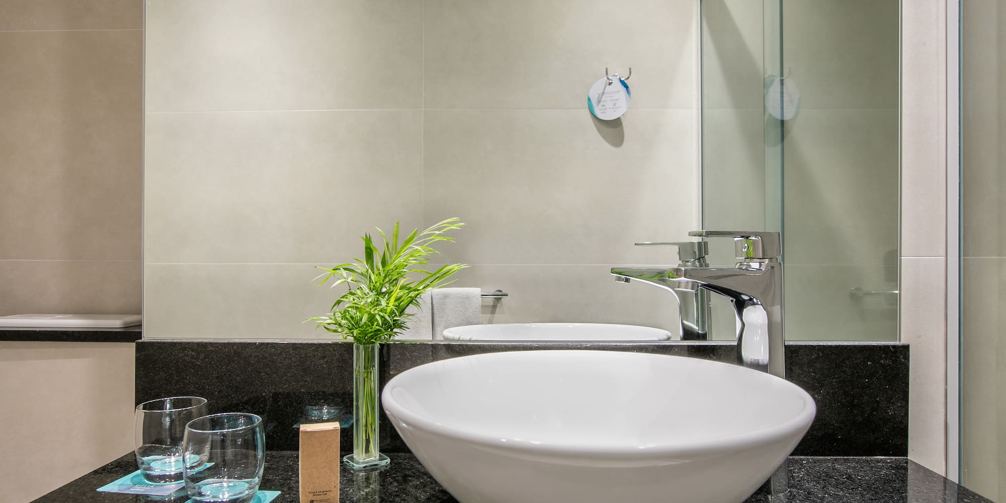 a sink and glass on a counter