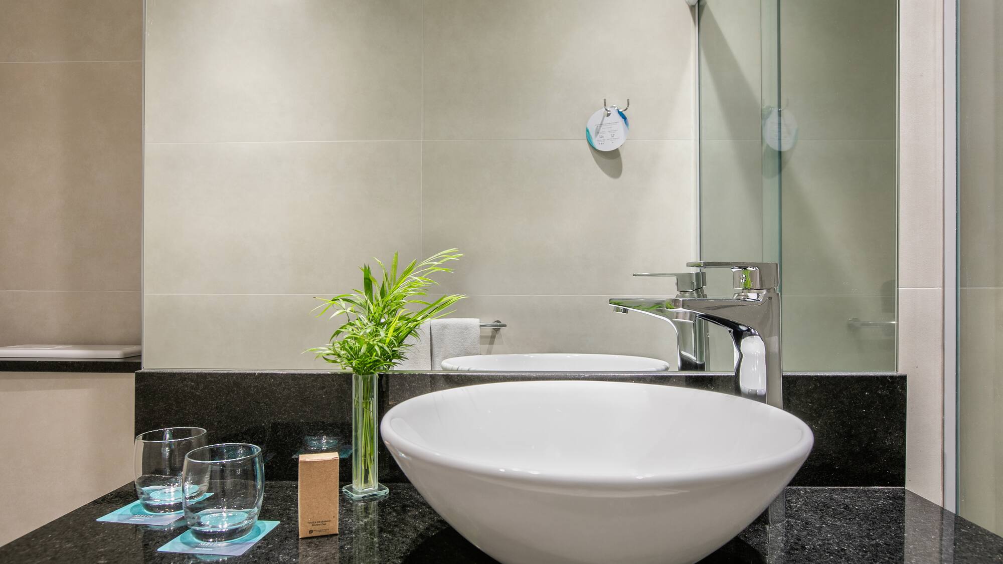 a sink and glass on a counter