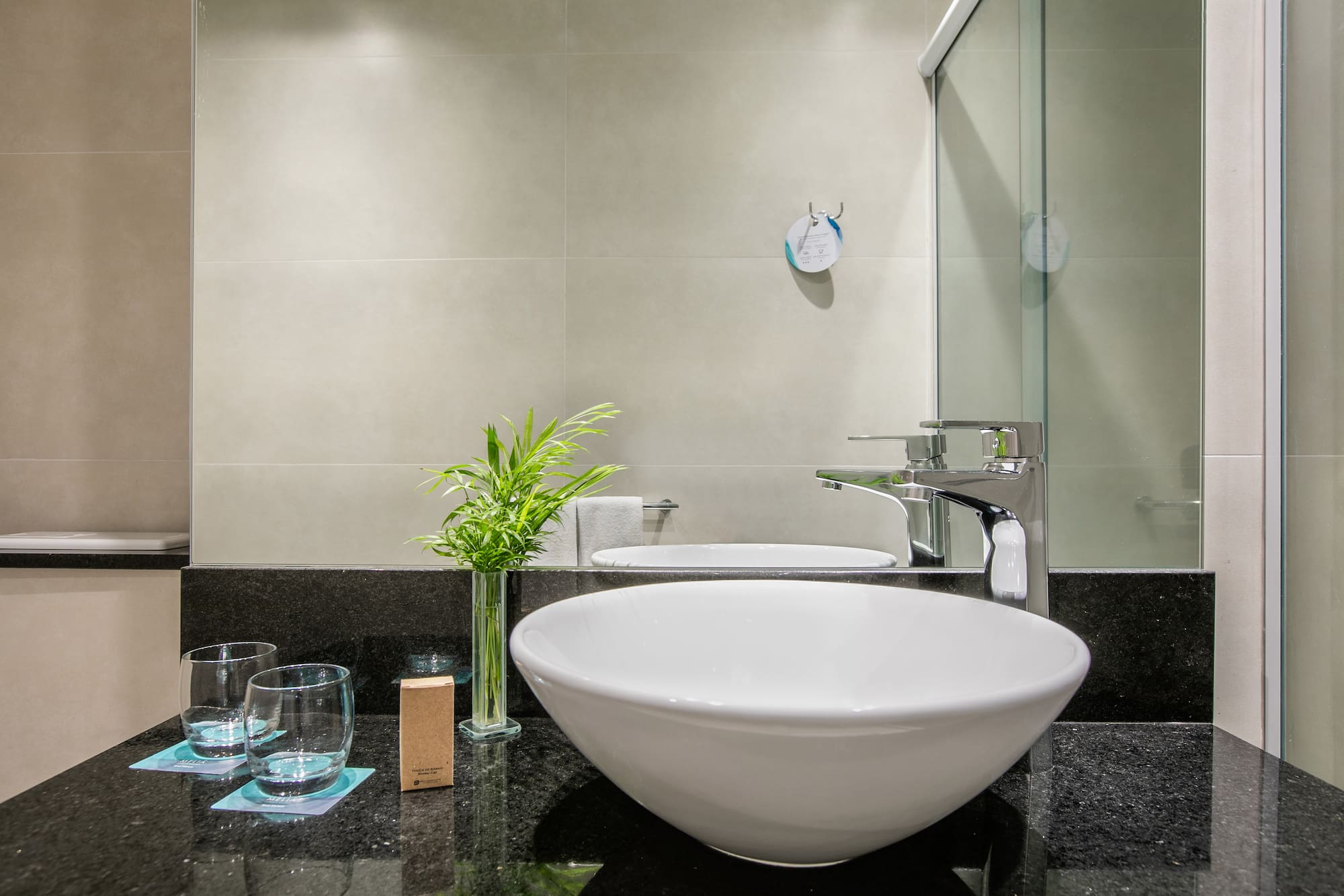 a sink and glass on a counter
