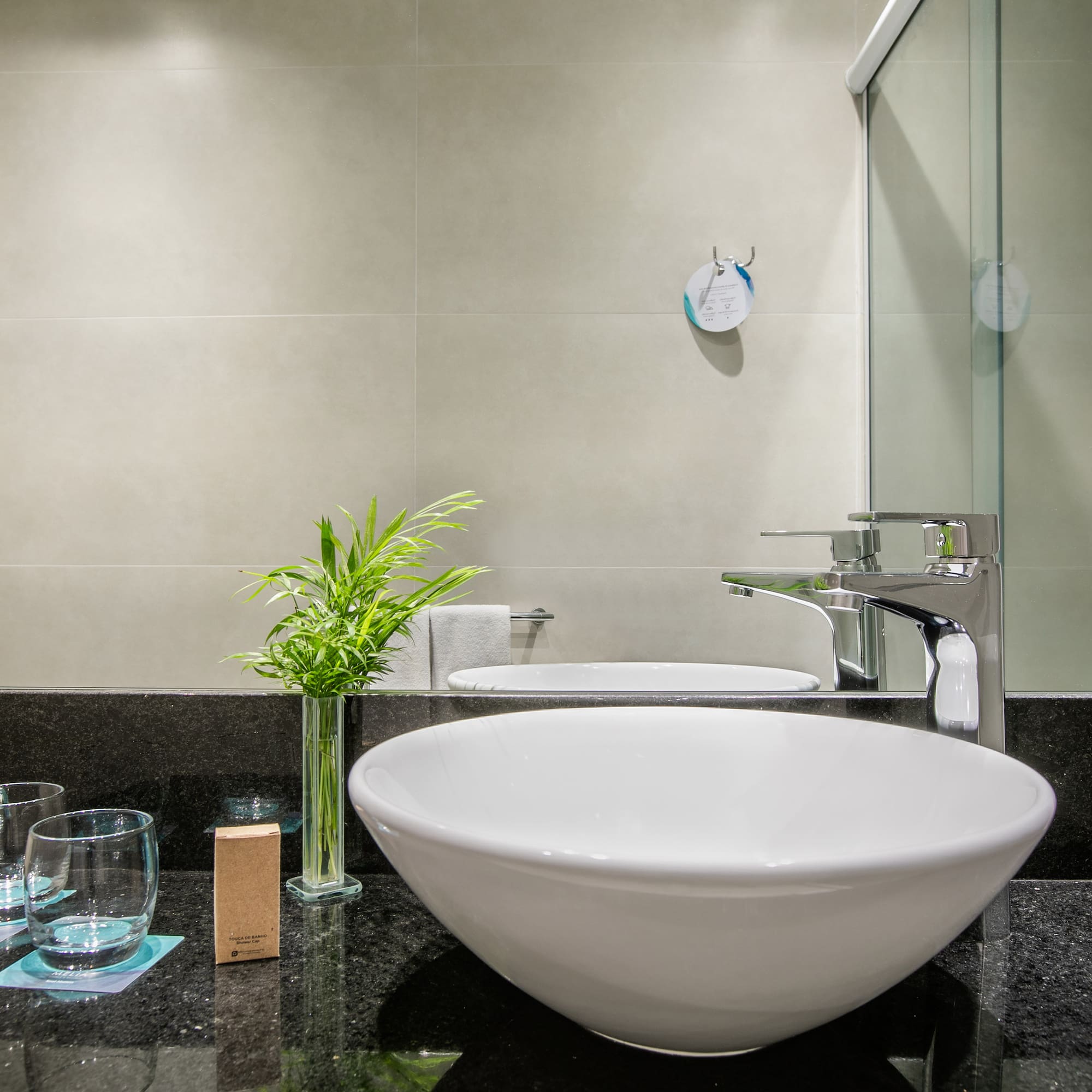 a sink and glass on a counter
