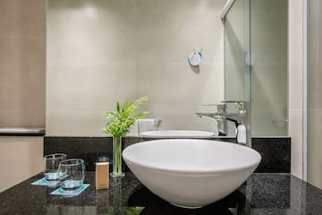 a sink and glass on a counter