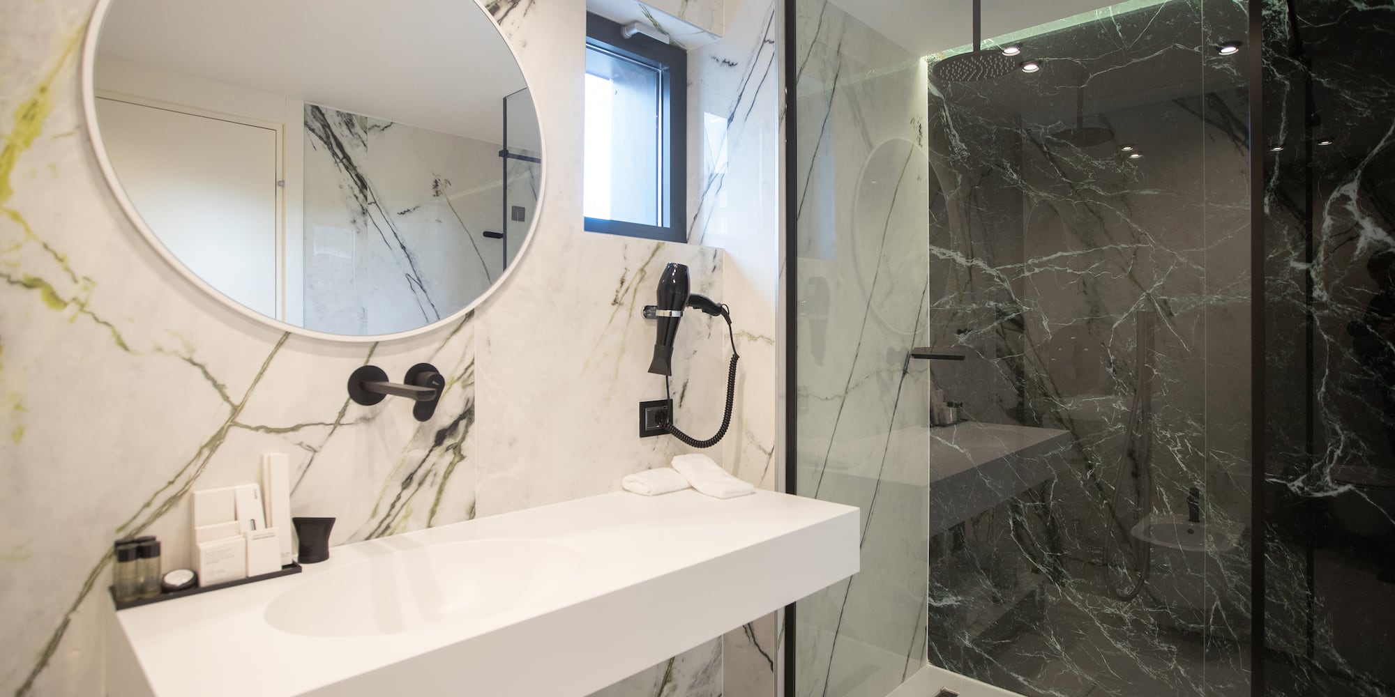 a bathroom with a mirror and a shower