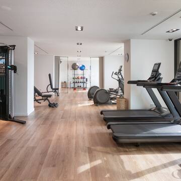 a room with exercise equipment and exercise machines