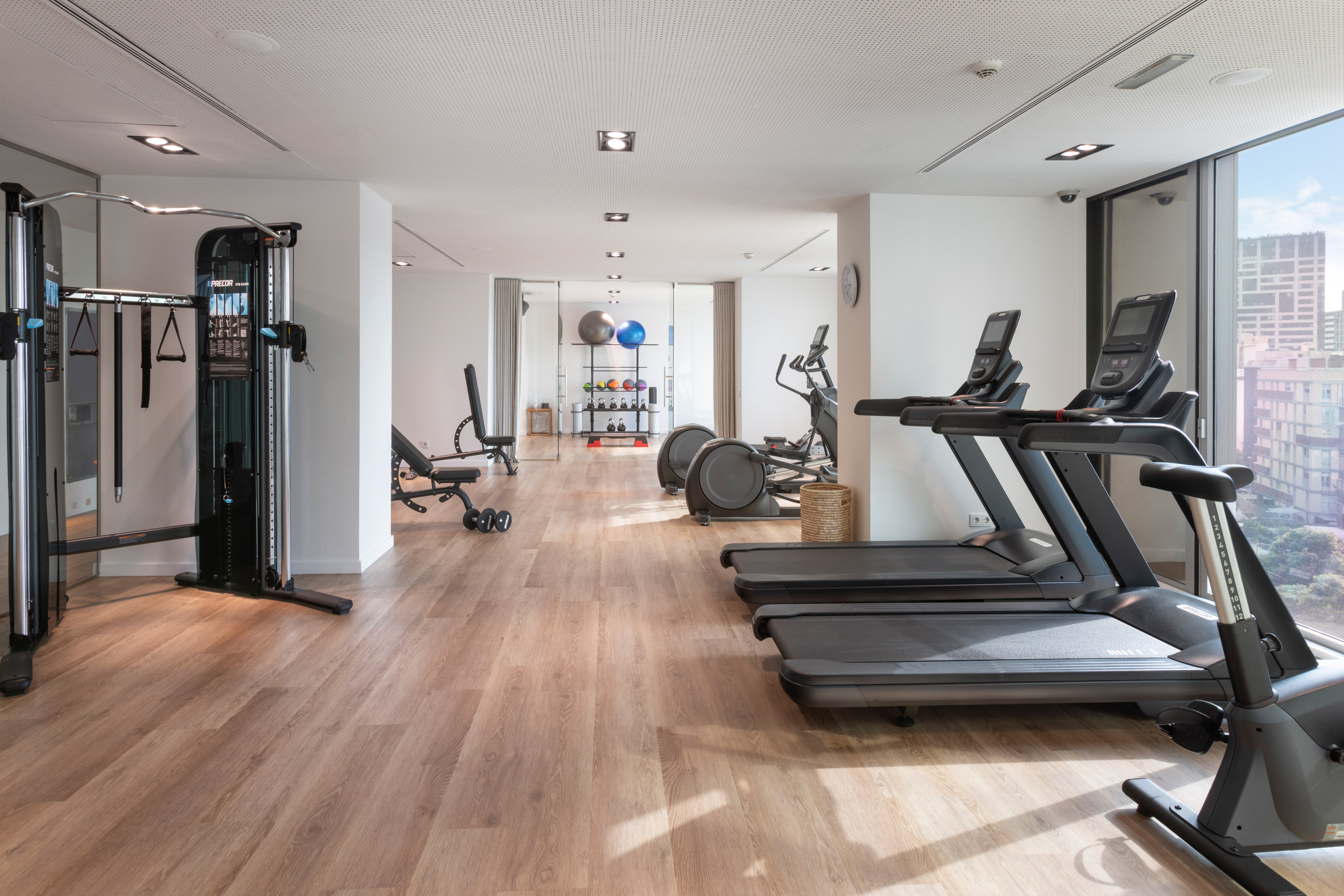 a room with exercise equipment and exercise machines