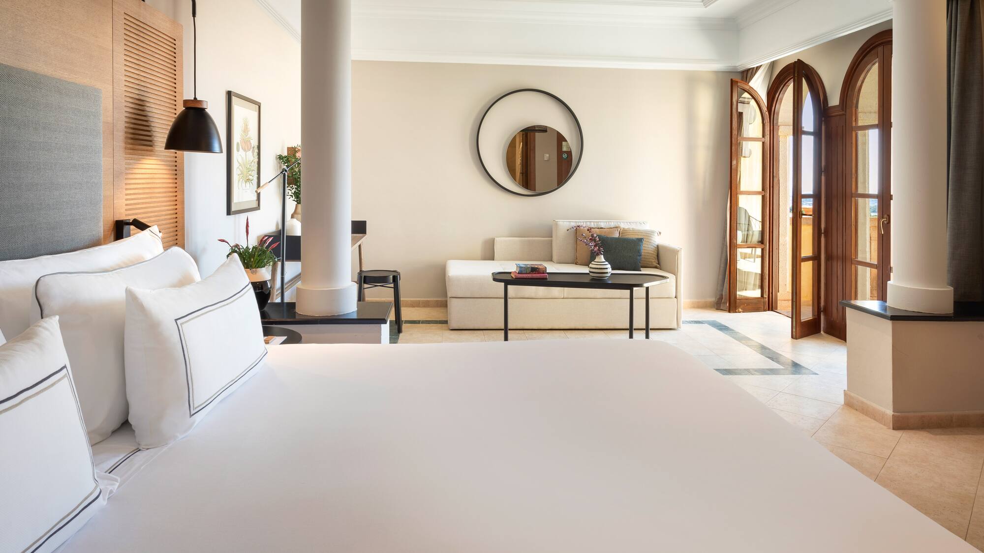 a room with a large bed and a couch