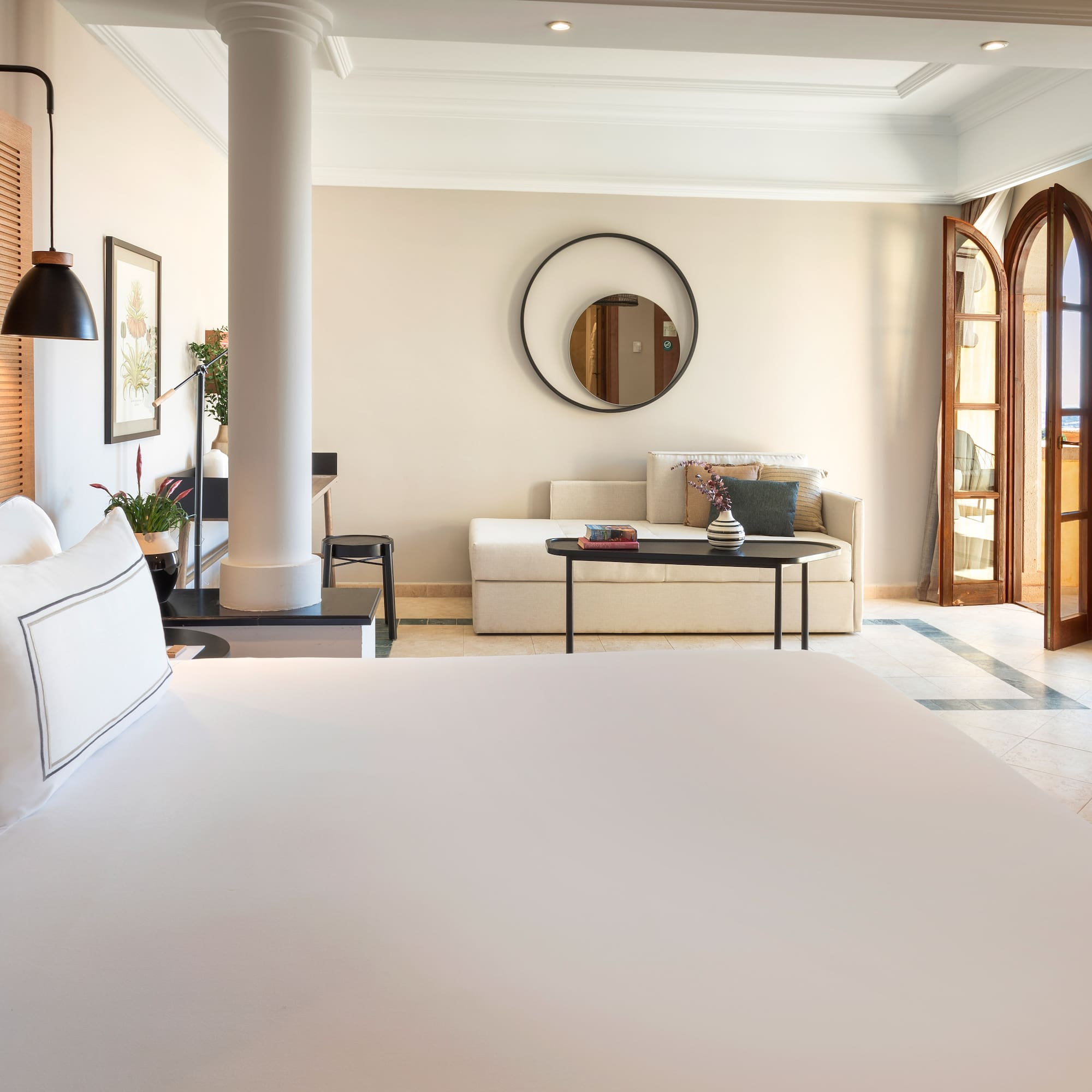 a room with a large bed and a couch