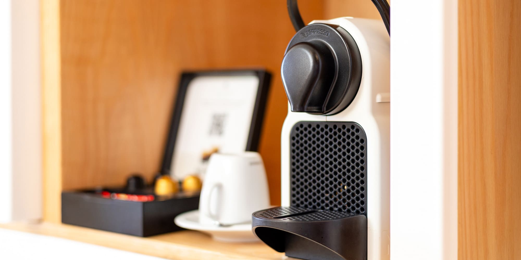 a coffee machine on a shelf