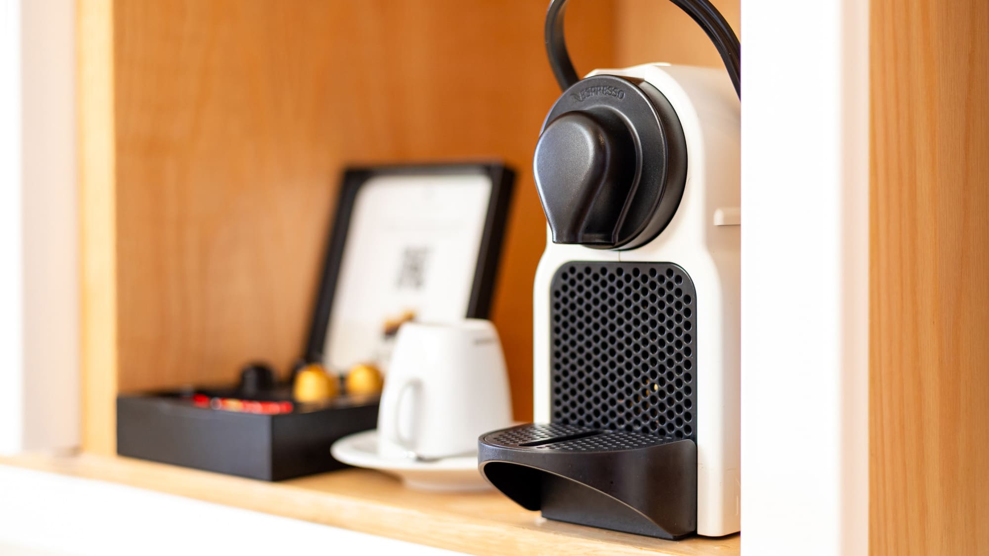 a coffee machine on a shelf