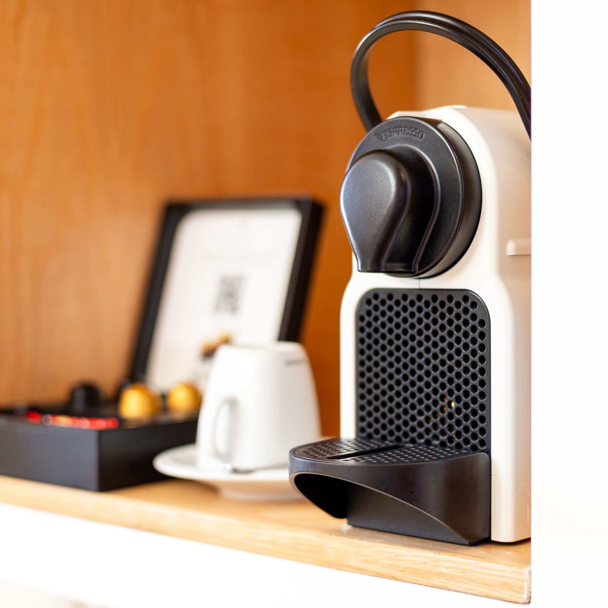 a coffee machine on a shelf