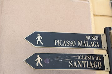 a sign board with a person walking on it