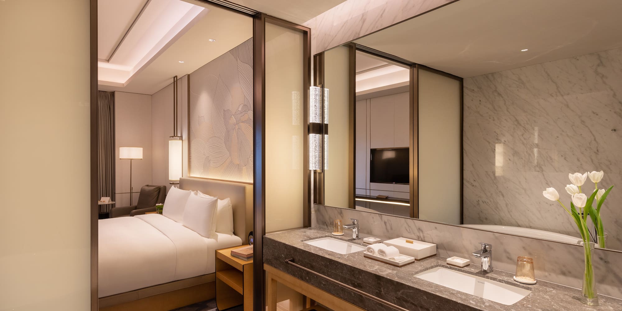 a bathroom with a bed and a mirror