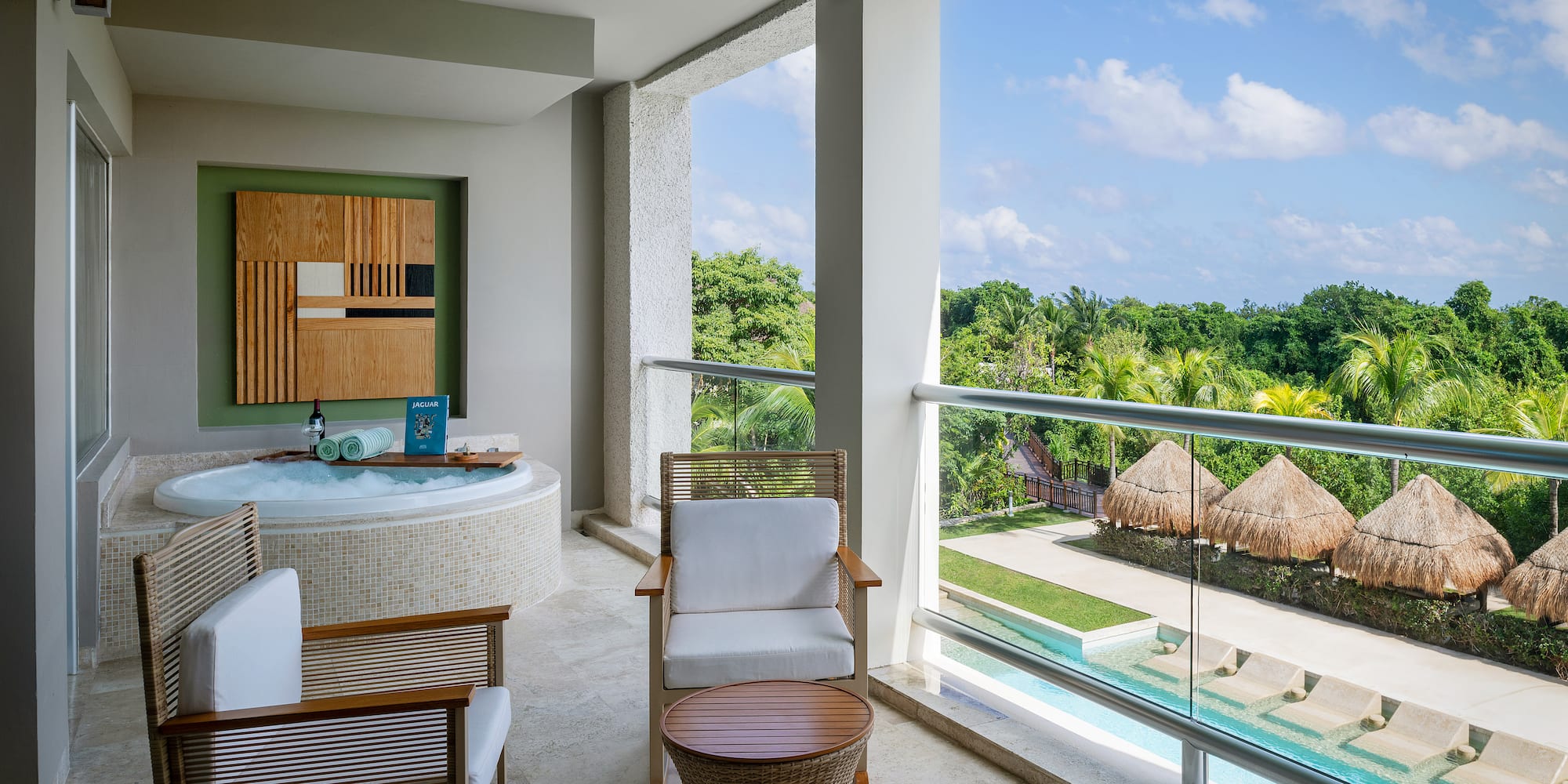 a jacuzzi with a view of the pool and a deck