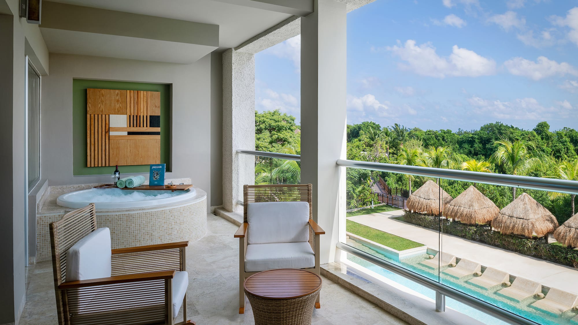 a jacuzzi with a view of the pool and a deck