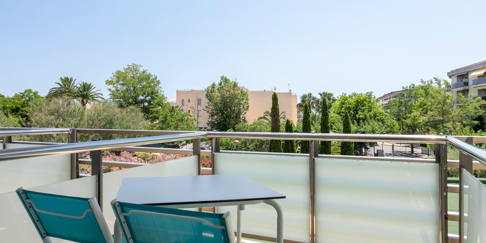 a table and chairs on a balcony