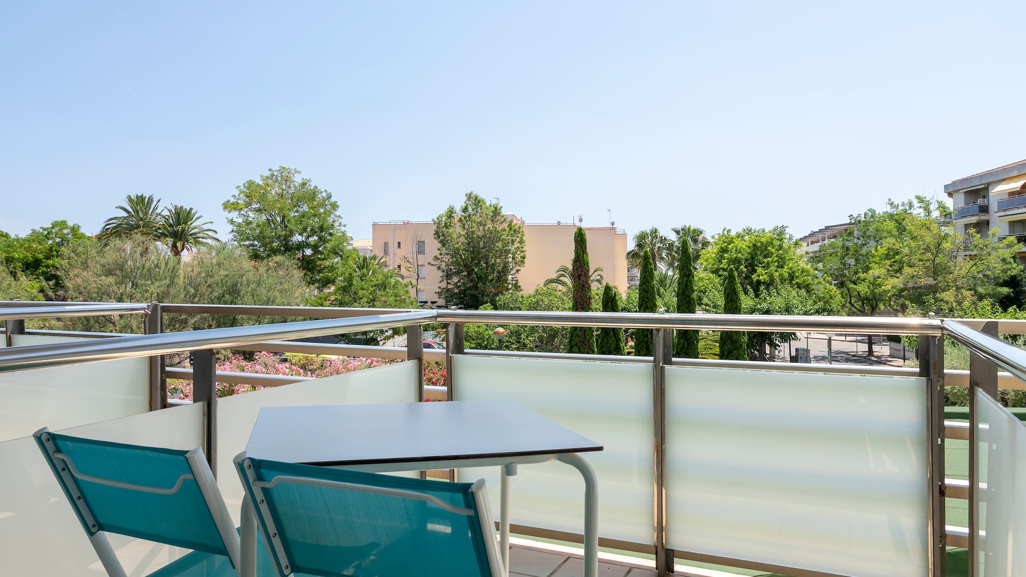a table and chairs on a balcony