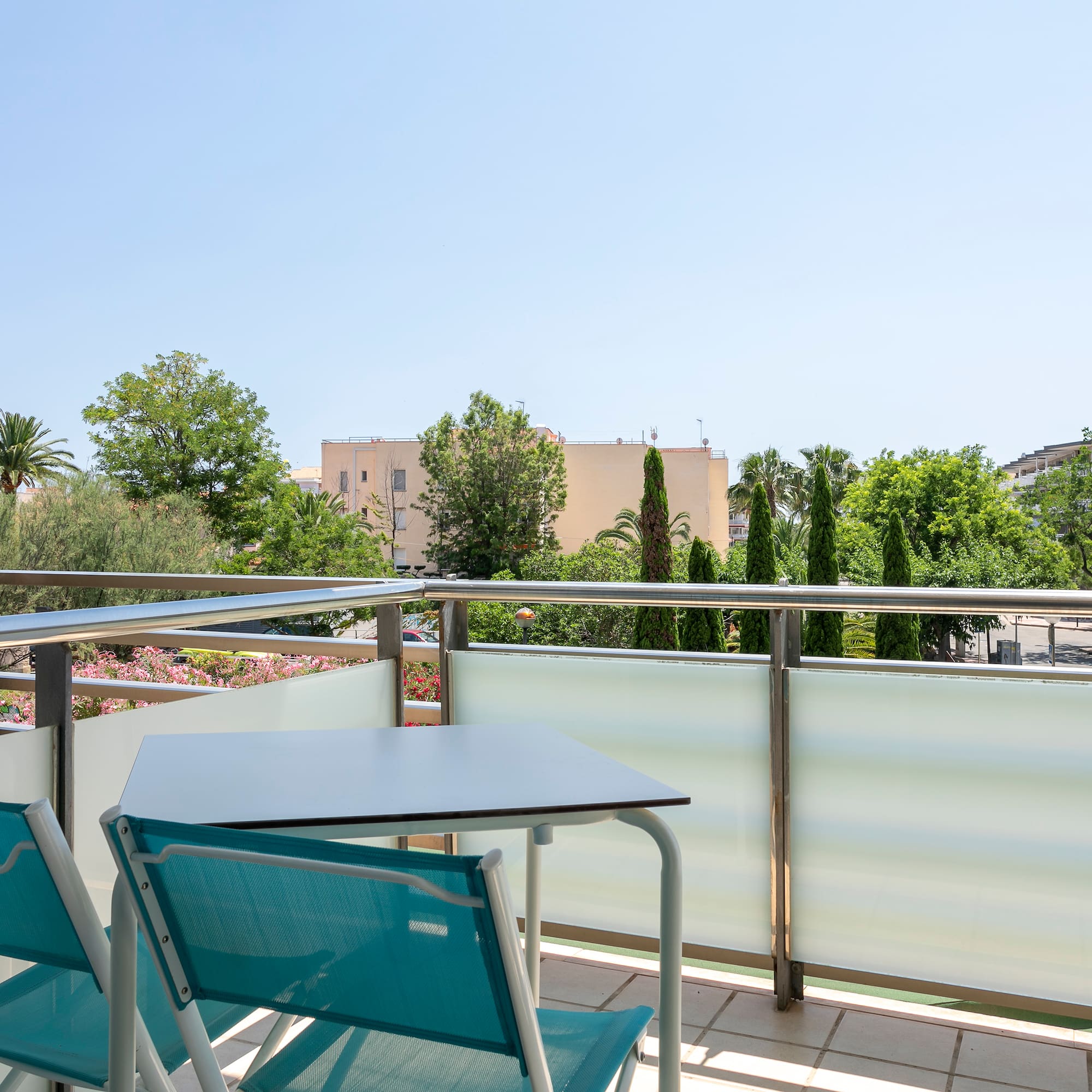 a table and chairs on a balcony