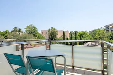 a table and chairs on a balcony