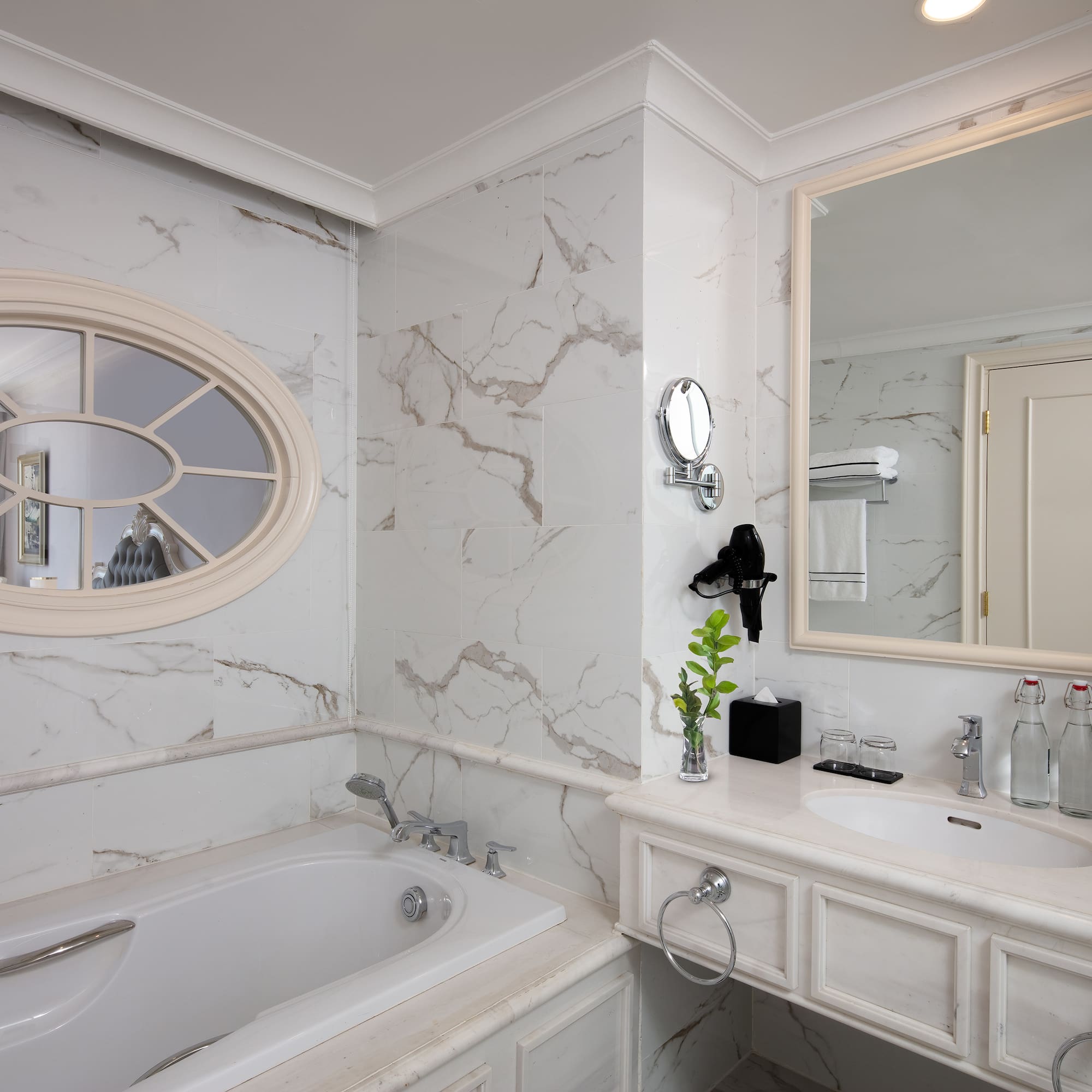 a bathroom with a tub and sink