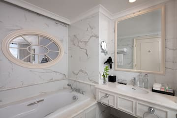 a bathroom with a tub and sink