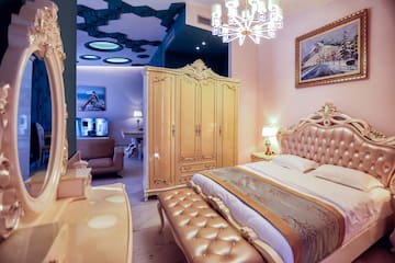a bedroom with a bed and a wardrobe