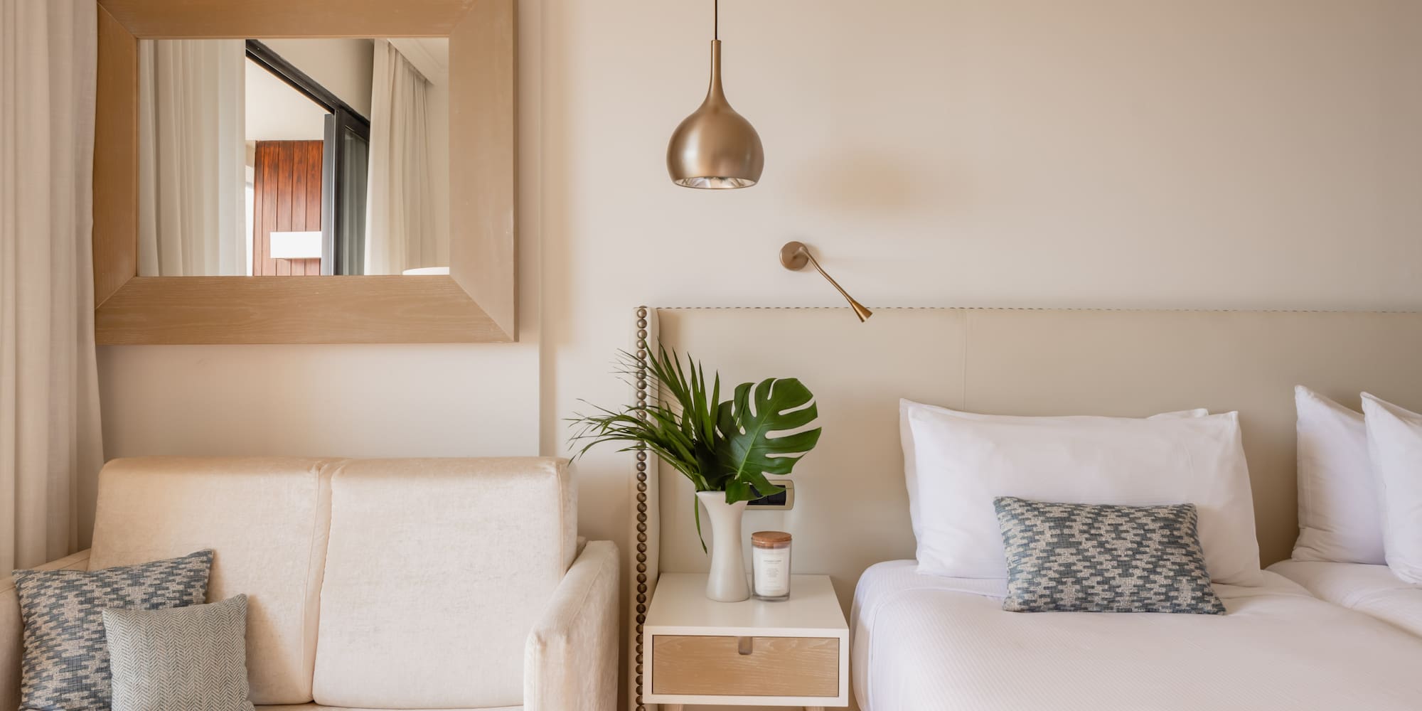 a bedroom with a bed and couch